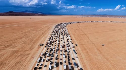 Beautiful vast valley with a flow of cars and campervans standing and moving in lines.