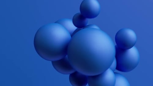 Des sphères bleues dynamiques flottent dans un mouvement numérique moderne et abstrait