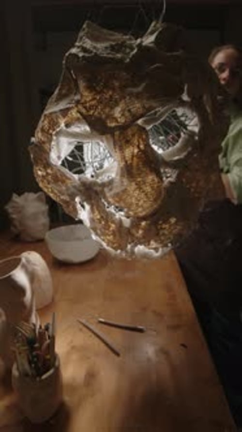 Sculptor Creating Masterpiece in Workshop at Night