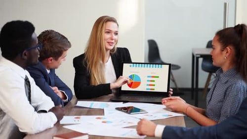 Business Team Discussing Data at Modern Meeting