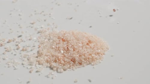 Sprinkling himalayan salt onto a table