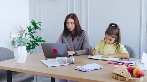 A Devoted Mother Balances Her Demanding Job While Homeschooling Her Child Mother Works in Her Office