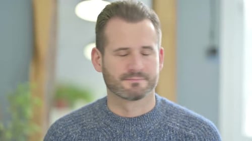 Man Stares Directly into Camera, Close Up Shot
