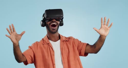 Man, virtual reality and glasses in studio with wow, hand and happy surprise in metaverse by blue