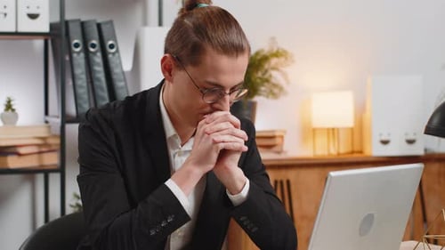 Tired Pensive Caucasian Businessman Thoughtful Taking Break After Laptop Work at Home Office Desk