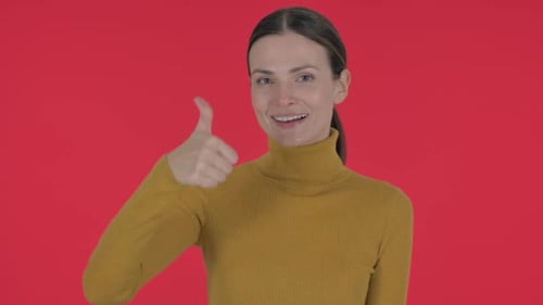 Smiling Woman Giving a Thumbs Up Approval