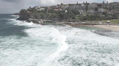 Scenery Of White Splashing Waves At Bronte Beach With Bronte Pool Baths In Eastern Suburbs, Sydney,