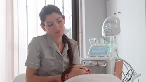 Woman Receives Facial Massage in Medical Spa