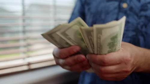 Hands Counting Money, Stacking One Hundred Dollar Bills