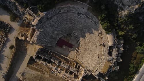 Echoes of Past Ancient Amphitheater Amidst Turkish Nature Ancient Amphitheater Nestled in Heart of