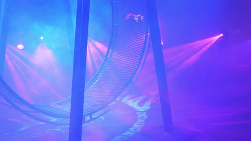 A Rotating Wheel of Death for Acrobats to Perform Under the Dome of the Circus