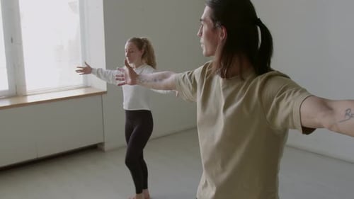 Dancers Doing Forward and Lateral Leg Swings during Warmup in Studio