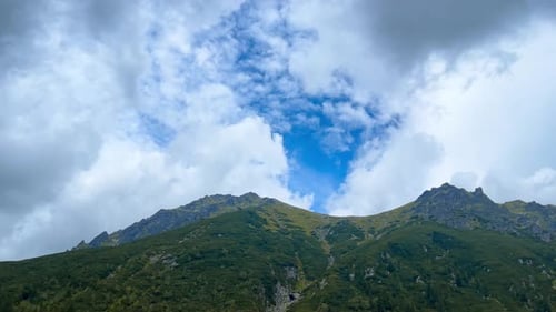 Mountain range and moving clouds.