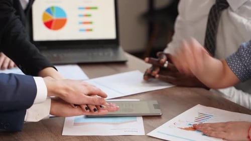 Collaborative Team Puts Hands Together in Unity