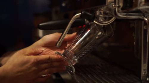 SLOWMO - Coffee Machine prepares espresso in long glass coffee - CLOSE UP