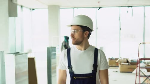 Confident Builder Engineer Architect Walk on a Construction Site