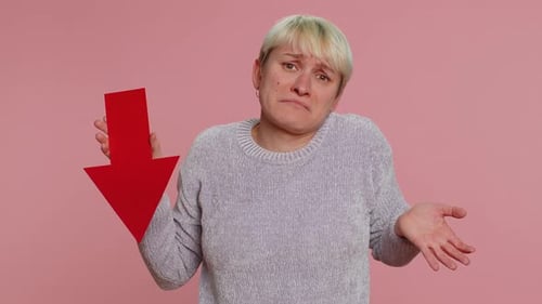 Upset Young Woman Showing Red Arrow Pointing Down Concept of Downgrade Bankruptcy Money Fail Fall