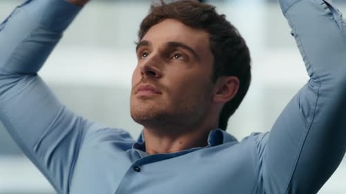 Closeup Man Relaxing Dreaming at Office. Satisfied Businessman Having Break in Panoramic