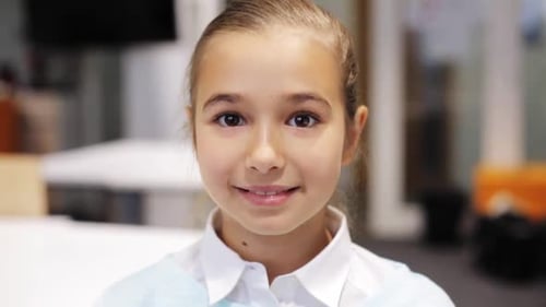 Smiling Girl Looking at the Camera Indoors