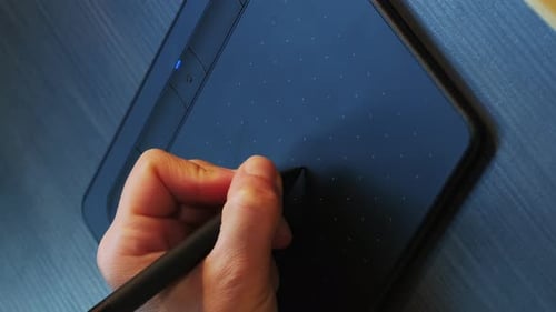 Drawing on graphics tablet with stylus, close up of pen display. Vertical video