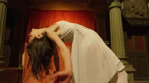 Dancer Performing a Dramatic Solo Under Dim Lighting