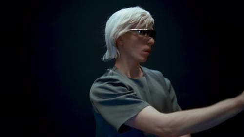 Man With White Hair Interacts with Invisible Technology