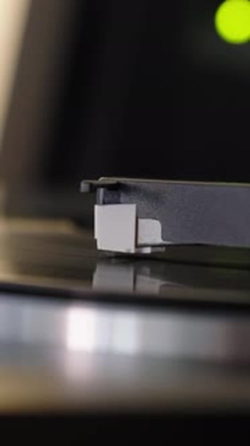 Record Player Needle Plays a Vinyl Record