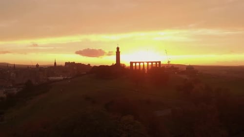 Aerial view of beautiful Edinburgh Scotland during dramatic sunset- Drone shot from Calton Hill