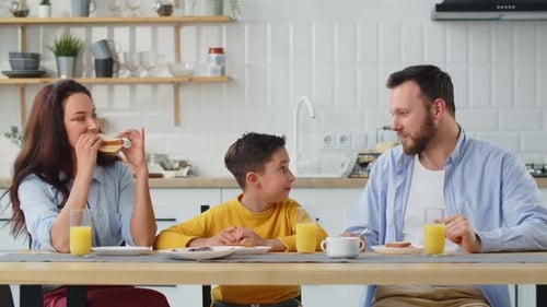 Family Enjoying Breakfast Together in Bright Kitchen