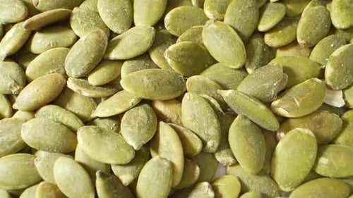 An up-close and detailed view of pumpkin seeds.