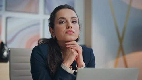 Smiling Young Woman in Corporate Workplace Environment