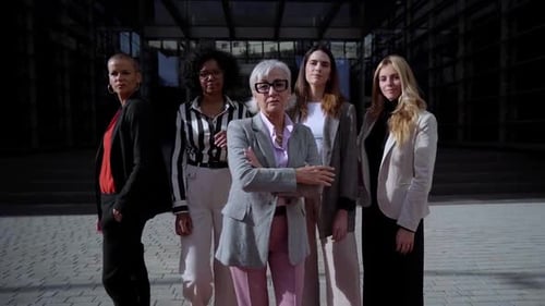 Diverse Group of Women Standing Confidently Outside Office