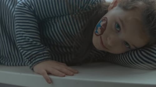 Cheerful Little Girl with International Air Shipping Painting on Her Face Cargo and Shipping Concept