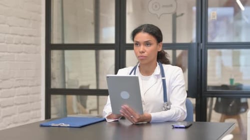 Doctor Working with Tablet in Modern Office