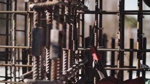 Welding Metal Beams Together on Construction Site