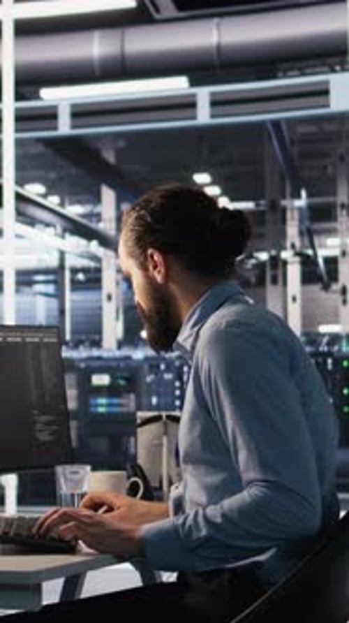 Vertical Video Data Center System Administrator Talking with Coworker in Office