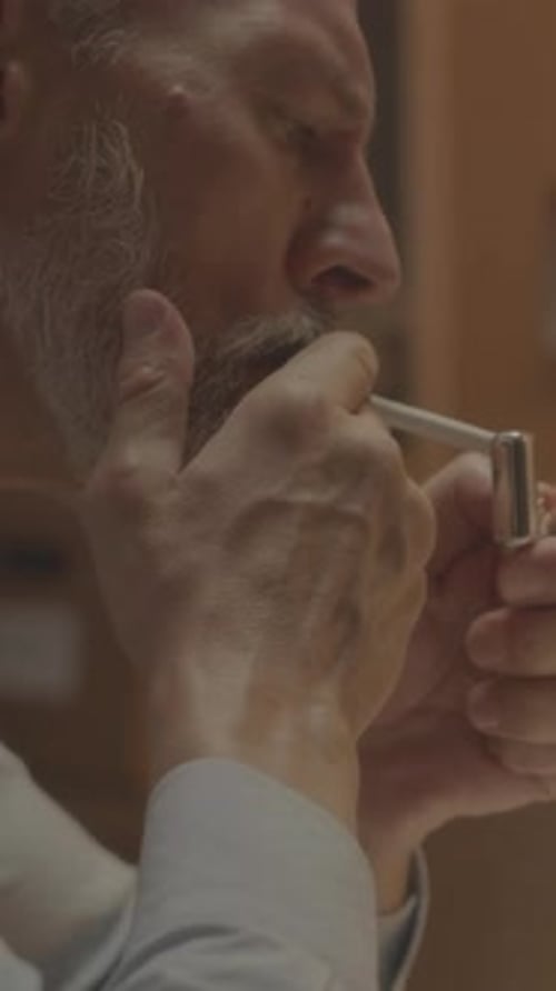 Detective Lighting Cigarette in Office