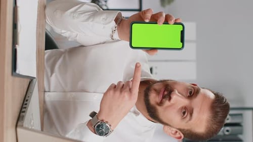 Developer Business Man Hold Smartphone with Green Screen Chroma Key Recommend Application Sale Offer