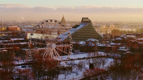Snowy Riga Morning, Ferris Wheel, National Library in Soft Golden Light, Drone