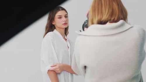 Woman Modeling in Studio for Photographer