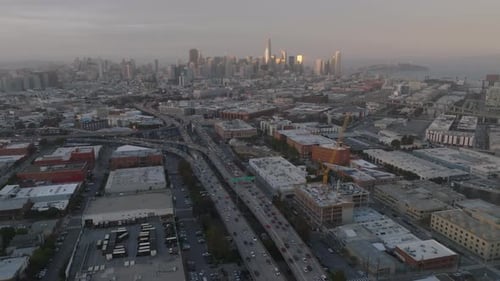 Aerial Panoramic View of Metropolis with Busy Transport Infrastructure and Downtown Skyscrapers in