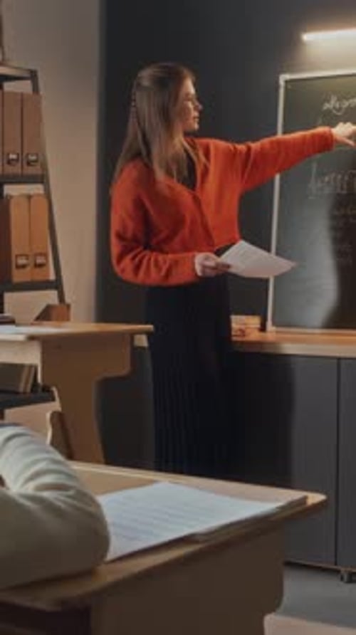 Teacher Asking Question and Little Boy Raising Hand to Answer