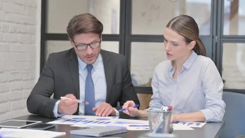 Busy Business People Doing Paperwork in Office