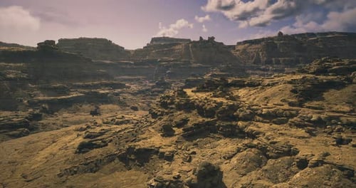 Grand Rocky Landscape with Rugged Terrain Under Bright Sky During Daytime
