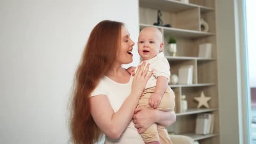 Mother and Baby Smiling Indoors