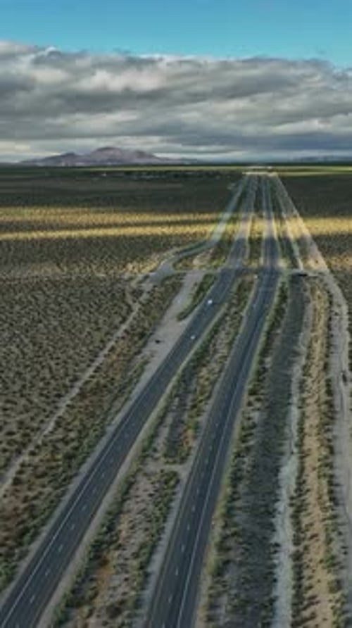 Aerial view of an empty highway in the Nevada desert landscape