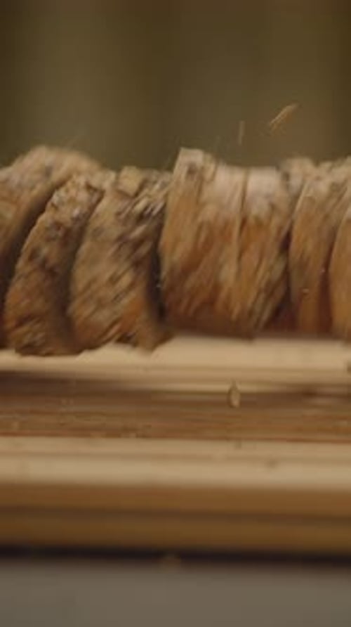Slices of Bread Falling on Cutting Board in Slow Motion