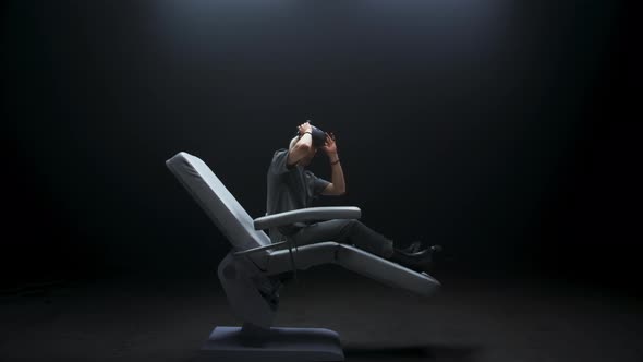 Adult Reclining in Chair Putting On VR Headset, Technology Stock ...