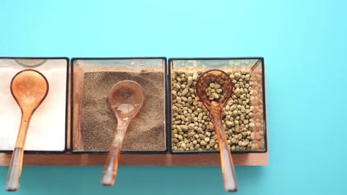 Top shot of different spices on blue background