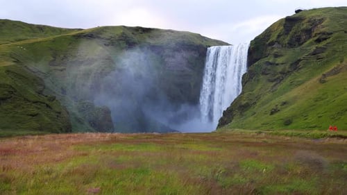 Incredible wide shot of Skógafoss, the famous waterfall in Iceland.